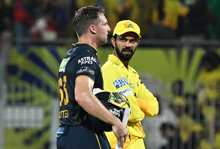 Gujarat Titans' Jos Buttler, left, walks with Chennai Super Kings' captain Ruturaj Gaikwad after Gujarat Titans won the Premier League cricket match against Chennai Super Kings in Chennai. - | Photo: AP