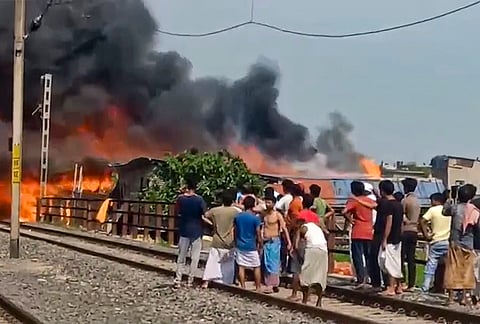 Smoke billows as fire breaks out in some shanties near Akra Santoshpur railway station on the Sealdah-Budge Budge railway line of Eastern Railway, in South 24 Parganas district, West Bengal.