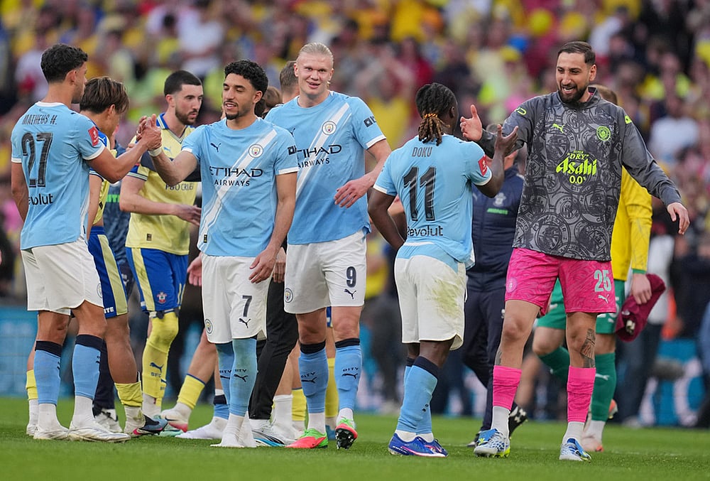 Manchester City players celebrate after the FA Cup semifinal soccer match between Manchester City and Southampton in Manchester, England. - | Photo: AP/Kin Cheung