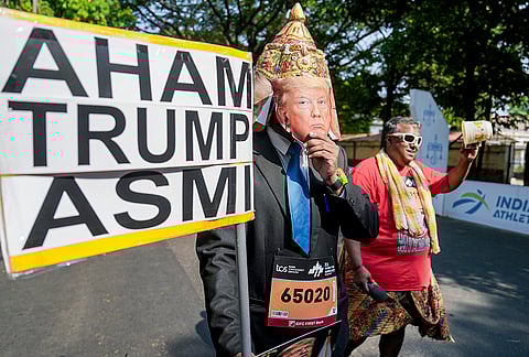 A person dressed as US President Donald Trump takes part in the TCS World 10K marathon, in Bengaluru.