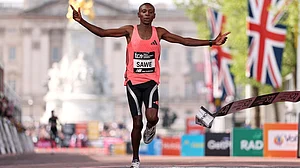 AP/Ian Walton : Sabastian Sawe from Kenya crosses the finish line to win the men's race at the London Marathon.