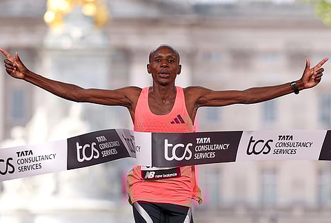 Sebastian Sawe from Kenya crosses the finish line to win the men's race at the London Marathon in London.