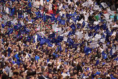 Chelsea fans cheer before the FA Cup semifinal soccer match between Chelsea and Leeds in London, England.