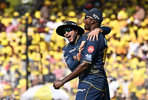Gujarat Titans' Jason Holder celebrates with captain Shubman Gill, left, after taking the catch to dismiss Chennai Super Kings' Urvil Patel during the Indian Premier League cricket match between Chennai Super Kings and Gujarat Titans in Chennai.