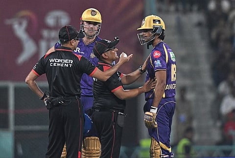 Kolkata Knight Riders' Angkrish Raghuvanshi, right, argues with the umpire after being given out during the Indian Premier League cricket match between Kolkata Knight Riders and Lucknow Super Giants in Lucknow.