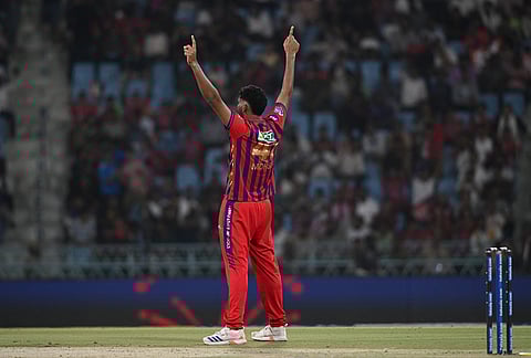 Lucknow Super Giants' Mohsin Khan celebrates the wicket of Kolkata Knight Riders' captain Ajinkya Rahane during the Indian Premier League cricket match between Kolkata Knight Riders and Lucknow Super Giants in Lucknow.