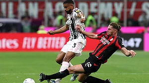 SerieA_EN/X : AC Milan and Juventus players in action in Serie A 2025-26 clash at the San Siro.