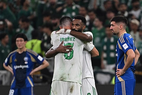 Al-Ahli's Feras Albrikan hugs his teammate Ibanez after scoring at Machida Zelvia, during the AFC Champions League Elite Final soccer match between Al-Ahli and Machida Zelvia at King Abdullah Sports City Stadium, in Jeddah, Saudi Arabia.