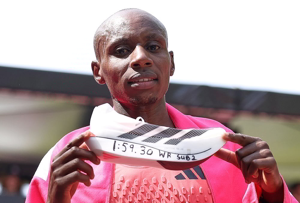 Sebastian Sawe from Kenya celebrates winning the men's race at the London Marathon in London. - | Photo: AP/Ian Walton