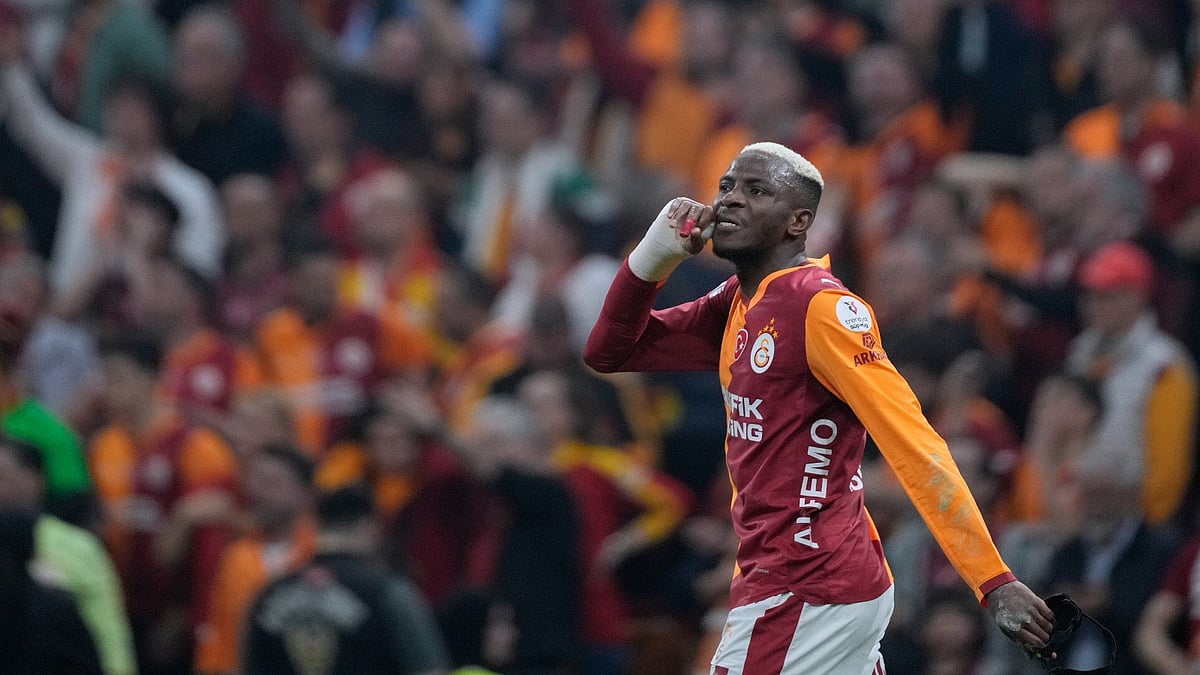 Galatasaray's Victor Osimhen celebrates after scoring the opening goal during a Turkish Super Lig soccer match between Galatasaray and Fenerbahce in Istanbul, Turke - AP Photo