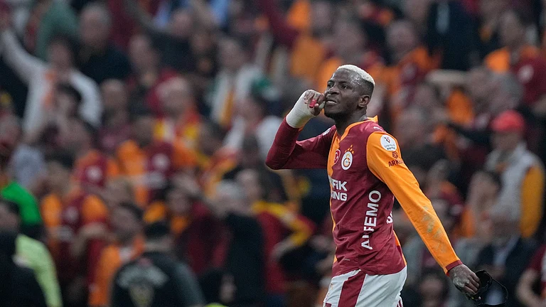 Galatasaray's Victor Osimhen celebrates after scoring the opening goal during a Turkish Super Lig soccer match between Galatasaray and Fenerbahce in Istanbul, Turke - AP Photo