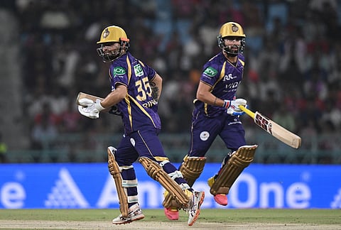 Kolkata Knight Riders' Rinku Singh, left, and his batting partner Ramandeep Singh run between the wickets during the Indian Premier League cricket match between Kolkata Knight Riders and Lucknow Super Giants in Lucknow.