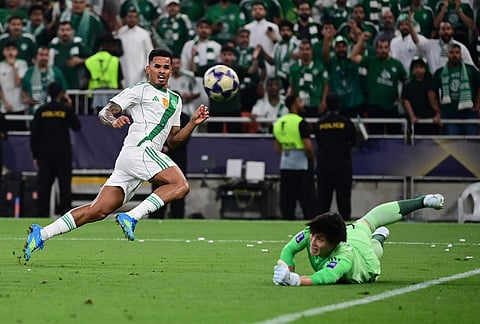 Machida Zelvia goalkeeper Kosei Tani faces Al-Ahli's Galeno during their AFC Champions League Elite Final soccer match at King Abdullah Sports City Stadium, in Jeddah, Saudi Arabia.