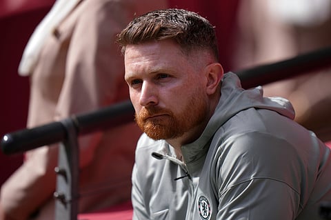 Chelsea's interim manager Calum McFarlane sits on the bench during the FA Cup semifinal soccer match between Chelsea and Leeds in London, England.