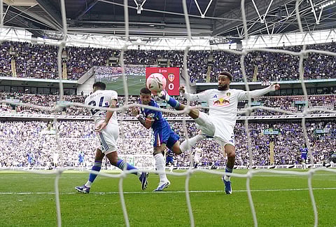 Chelsea's Enzo Fernandez, center, scores his side's opening goal during the FA Cup semifinal soccer match between Chelsea and Leeds in London, England.