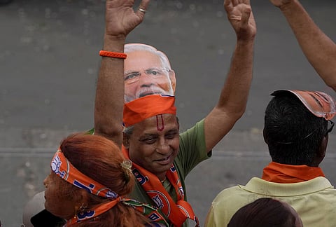 Supporters gather before Prime Minister Narendra Modi's roadshow, amid the ongoing West Bengal Assembly elections, in Kolkata, West Bengal.