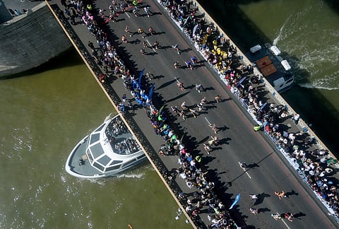Runners cross Tower Bridge during the 2026 London Marathon.