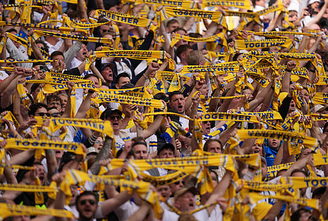 Leeds fans cheer before the FA Cup semifinal soccer match between Chelsea and Leeds in London, England.