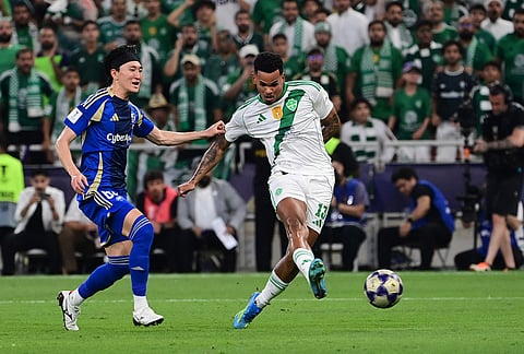 Machida Zelvia's Hotaka Nakamura, left, fights for the ball with Al-Ahli's Galeno during their AFC Champions League Elite Final soccer match at King Abdullah Sports City Stadium, in Jeddah, Saudi Arabia.