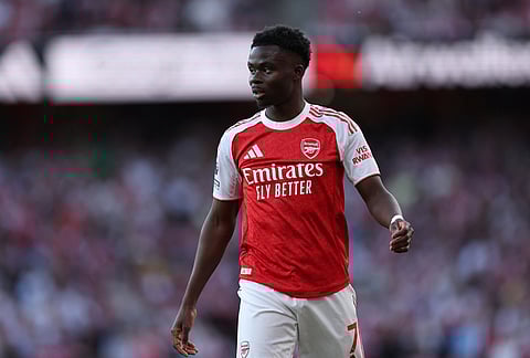 Arsenal's Bukayo Saka reacts during the English Premier League soccer match between Arsenal and Newcastle United in London.