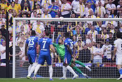 Chelsea's goalkeeper Robert Sanchez stops a shot from Leeds' Anton Stach during the FA Cup semifinal soccer match between Chelsea and Leeds in London, England.