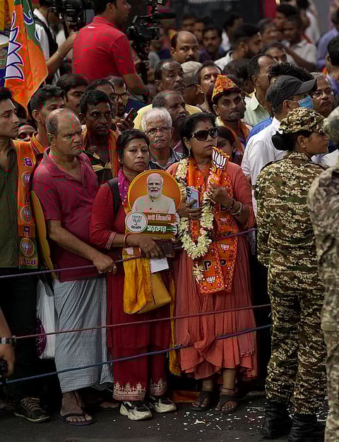 Supporters gather before Prime Minister Narendra Modi's roadshow, amid the ongoing West Bengal Assembly elections, in Kolkata, West Bengal.