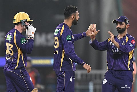 Kolkata Knight Riders' Varun Chakaravarthy, centre, celebrates with teammates the wicket of Lucknow Super Giants' Nicholas Pooran during the Indian Premier League cricket match between Kolkata Knight Riders and Lucknow Super Giants in Lucknow.