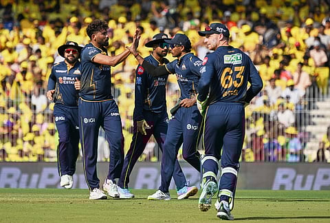 Gujarat Titans' Mohammed Siraj, second left, celebrates with teammates the wicket of Chennai Super Kings' Sarfaraz Khan during the Indian Premier League cricket match between Chennai Super Kings and Gujarat Titans in Chennai.