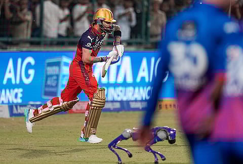 Royal Challengers Bengaluru's Virat Kohli enters the field during the Indian Premier League (IPL) T20 cricket match between Delhi Capitals and Royal Challengers Bengaluru, in New Delhi.