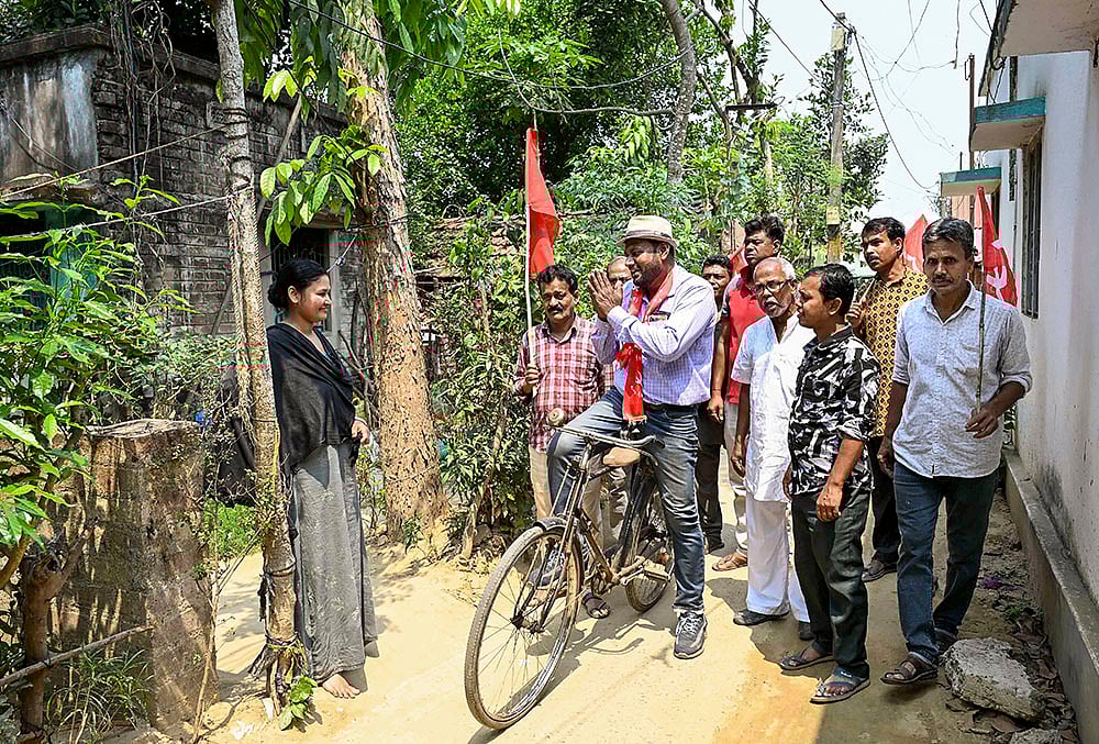 CPI(M) candidate from Santipur constituency, Soumen Mahato, campaigns for the West Bengal Assembly elections, in Nadia. - | Photo: PTI 