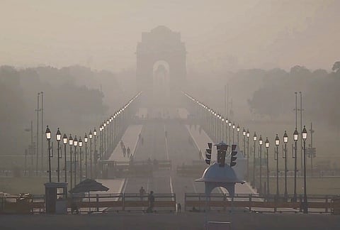 A hazy view of the India Gate, in New Delhi, Monday, April 27, 2026. Delhi woke up to a warm Monday morning with the minimum temperature settling at 25 degrees Celsius, 1.2 notches above the season's normal. 