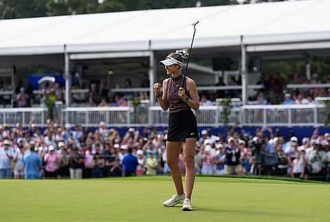 Nelly Korda celebrates after winning the Chevron Championship LPGA golf tournament in Houston.