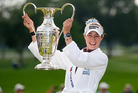 Nelly Korda holds the trophy after winning the Chevron Championship LPGA golf tournament in Houston.
