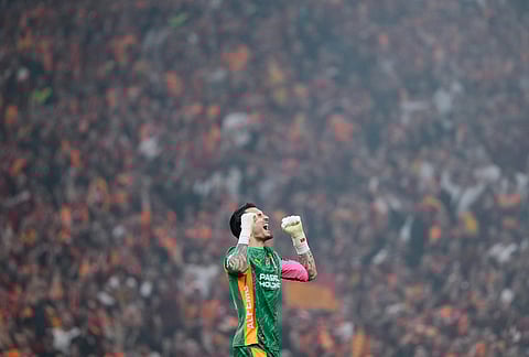 Galatasaray's goalkeeper Ugurcan Cakir celebrates a goal during a Turkish Super Lig soccer match between Galatasaray and Fenerbahce in Istanbul, Turkey.