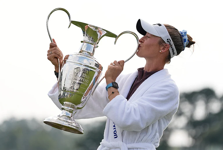 Nelly Korda poses with the trophy after winning the Chevron Championship LPGA golf tournament in Houston. - | Photo: AP/Ashley Landis