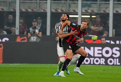 AC Milan's Niclas Fullkrug, right, reacts during the Serie A soccer match between AC Milan and Juventus, in Milan, Italy.