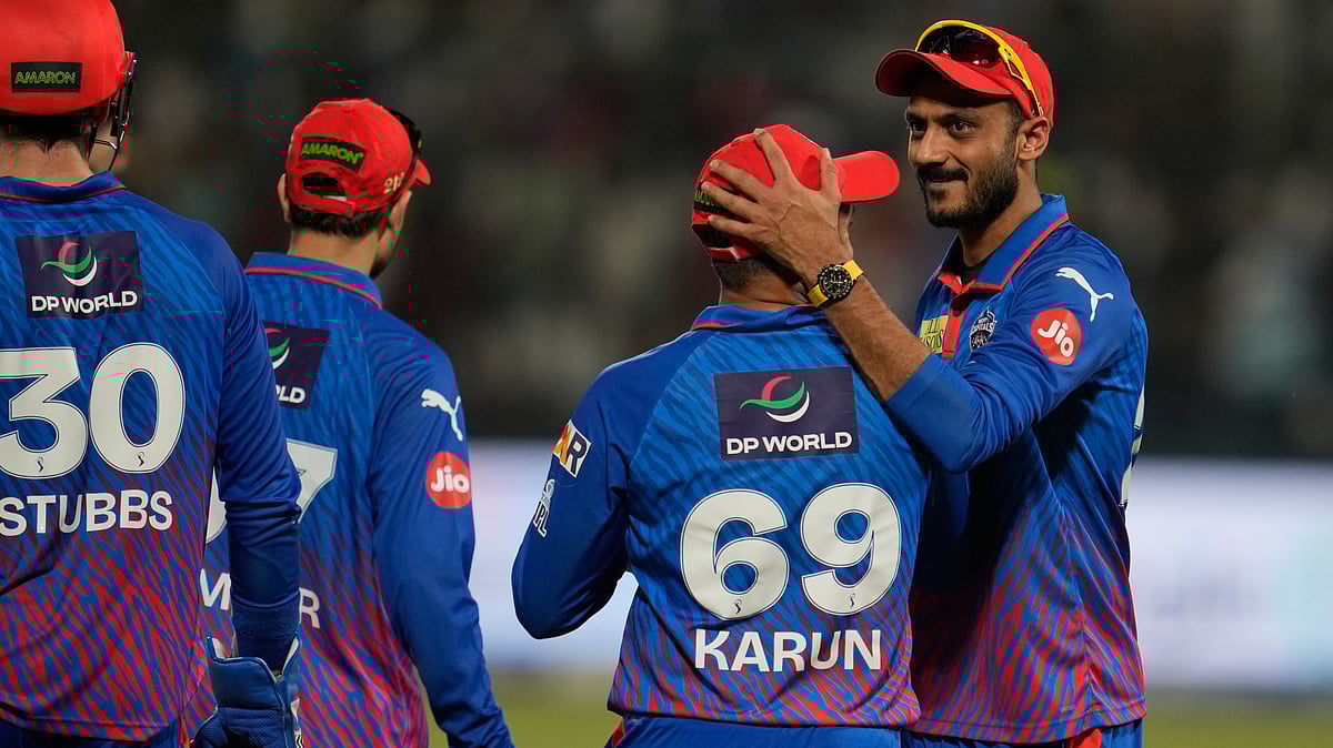 Delhi Capitals' Karun Nair, second from right, celebrates with captain Axar Patel after takes the catch to dismiss Punjab Kings' Nehal Wadhera during the Indian Premier League cricket match between Delhi Capitals and Punjab Kings in New Delhi, India, Saturday, April 25, 2026.  - | Photo: AP/Manish Swarup