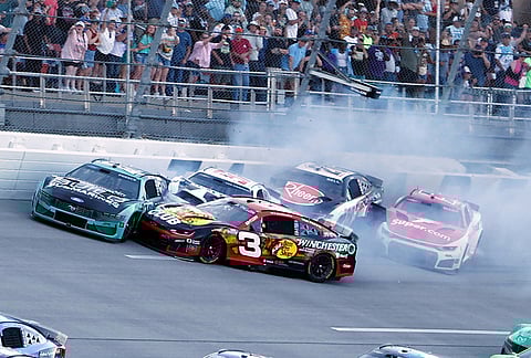 Ryan Preece (60), Austin Dillon (3), Christopher Bell (20), Shane Van Gisbergen (97) and Cody Ware (51) wreck on the final lap during a NASCAR Cup Series auto race, in Talladega, Alabama.