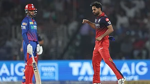 AP Photo : RCB cricketers celebrating a DC wicket during IPL 2026 clash at the Arun Jaitley Stadium in Delhi.