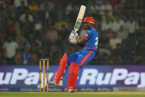 Delhi Capitals' Abishek Porel hits a boundary during the Indian Premier League cricket match between Delhi Capitals and Royal Challengers Bengaluru in Delhi.