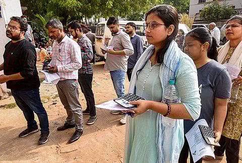 Aspirants wait in queues before appearing for the Bihar Public Service Commission (BPSC) 71st Combined Main (Written) Competitive Examination, in Patna.