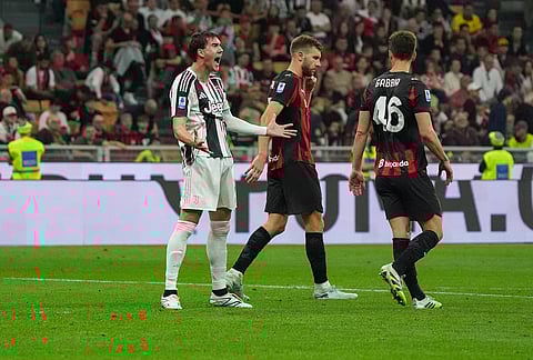Juventus's Dusan Vlahovic reacts during the Serie A soccer match between AC Milan and Juventus, in Milan, Italy.