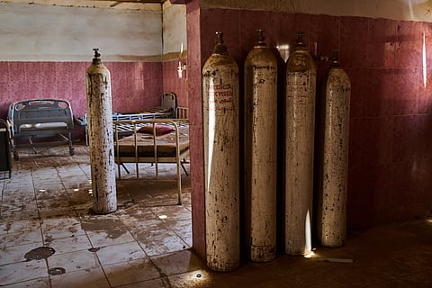 Oxygen canisters and hospital beds at a war-damaged section of Al Shaabi Hospital in Khartoum