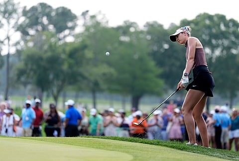 Nelly Korda chips to the green on the 18th hole during the final round of the Chevron Championship LPGA golf tournament in Houston.