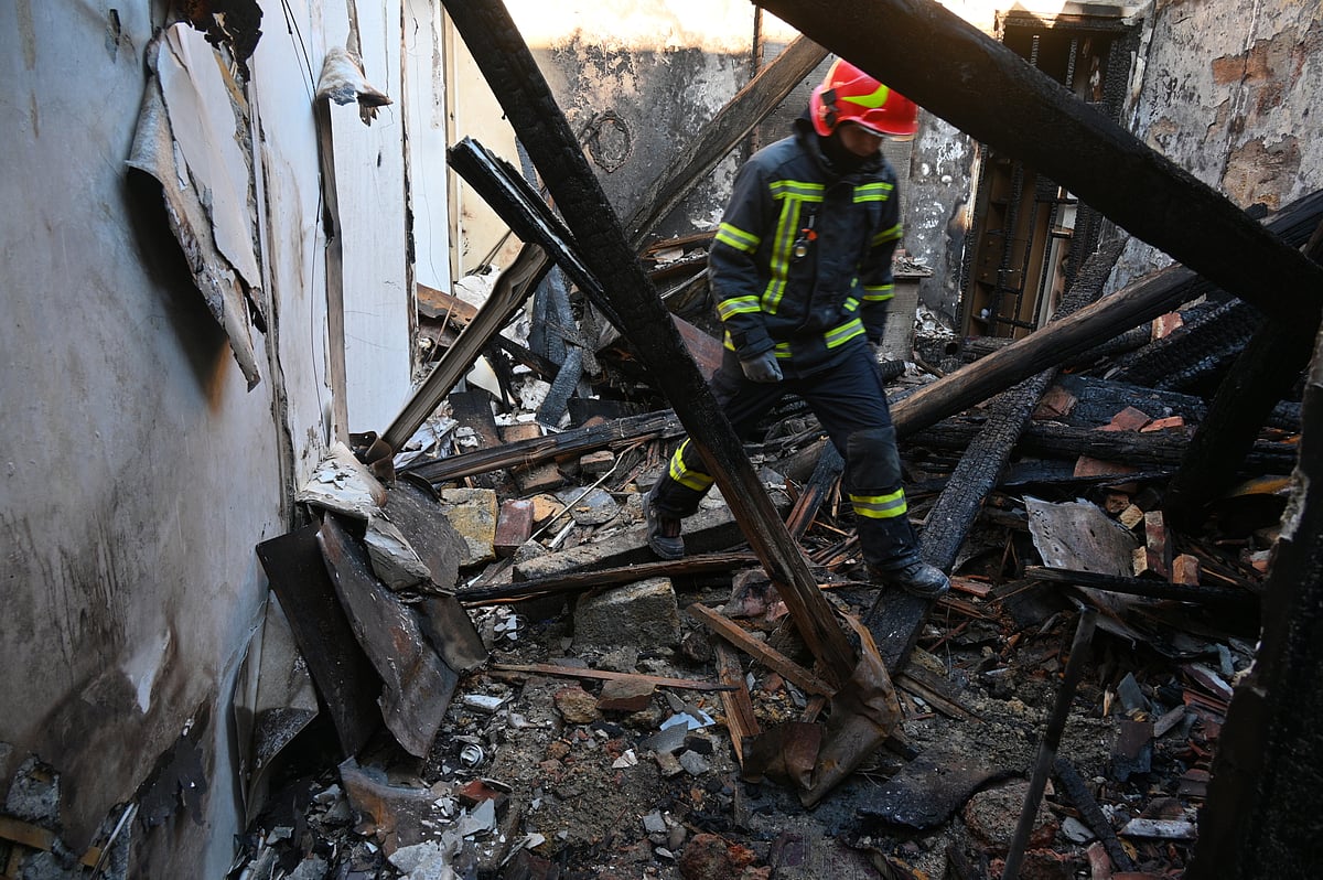 A rescue worker walks inside apartments destroyed by a Russian strike in Odesa, Ukraine, Monday, April 27, 2026. -  (AP Photo/Michael Shtekel)