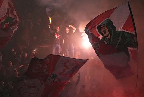 Red Star fans light fireworks during a Serbian National soccer league derby match between Red Star and Partizan in Belgrade, Serbia.