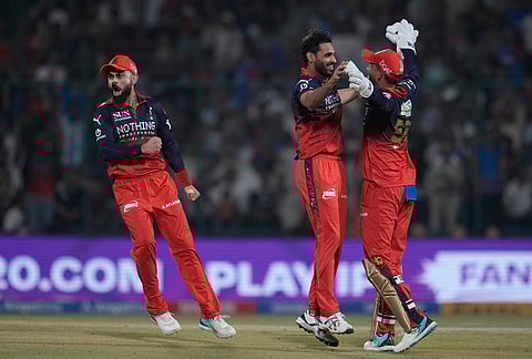 Royal Challengers Bengaluru's Bhuvneshwar Kumar, center, celebrate with teammates the wicket of Delhi Capitals' Tristan Stubbs during the Indian Premier League cricket match between Delhi Capitals and Royal Challengers Bengaluru in Delhi.