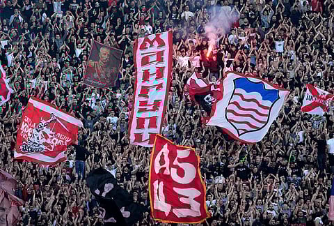 Red Star fans cheer during a Serbian National soccer league derby match between Red Star and Partizan in Belgrade, Serbia.