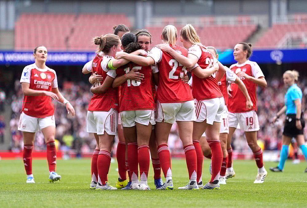 Arsenal's players celebrate their side's second goal scored by Olivia Smith during the Women's Champions League semi-final, first leg soccer match between Arsenal and OL Lyonnes in London, England. - | Photo: Andrew Matthews/PA via AP