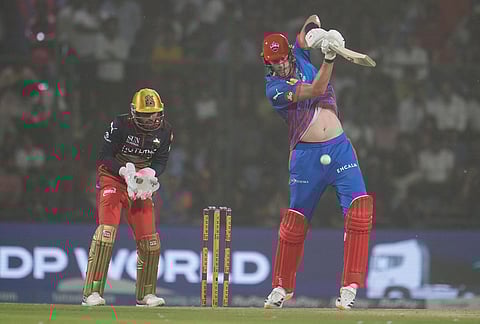 Delhi Capitals' Kyle Jamieson plays a shot during the Indian Premier League cricket match between Delhi Capitals and Royal Challengers Bengaluru in Delhi.